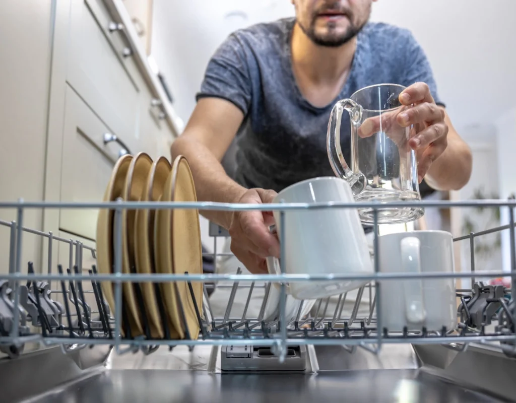 Vista CA plumber performing professional dishwasher installation with secure water line connections.